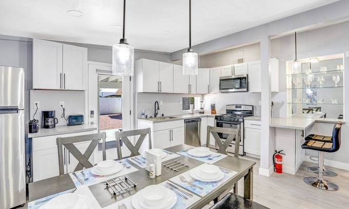 North Las Vegas House | Remodeled Home with Lush Landscapes, King Beds, BBQ, Games, Workspace and More!