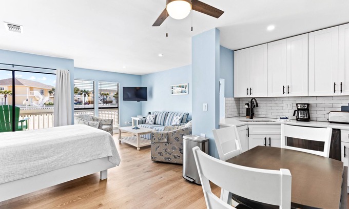 Emerald Coast Apartment | Renovated Studio condo with partial view of beach dunes-Beach Service included