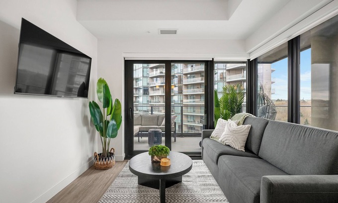 Eau Claire Apartment | River Views w XL Patio, Parking, Office, 2BR