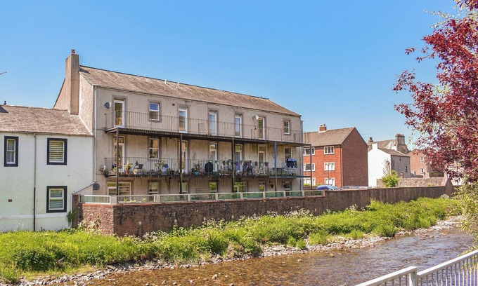 Cockermouth Cottage | Riverside apartment with private balcony and direct views over the river.
