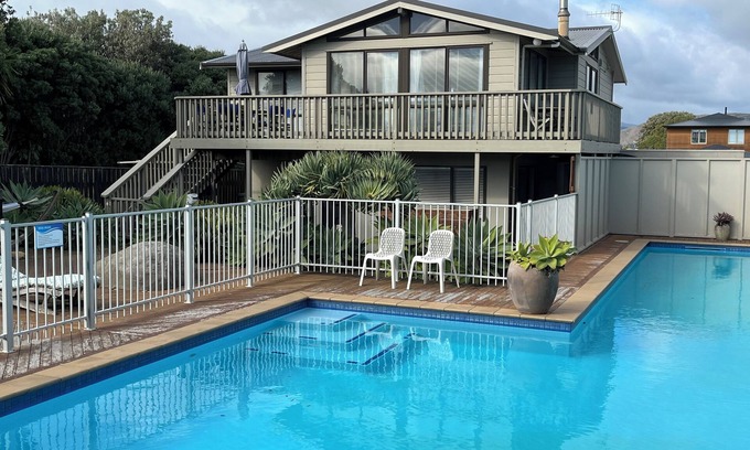 Waikanae House | SEABREEZE@Longshore: heated swimming pool, spa, tennis court, 2 minutes to beach