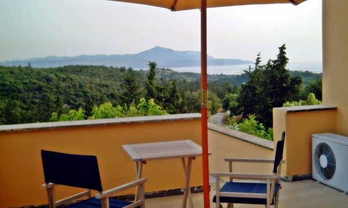 Douliana House | Small village house, shared pool and views of the countryside and sea