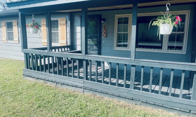 Ava House | Snuggle up and relax with the whole family at this Ava home.