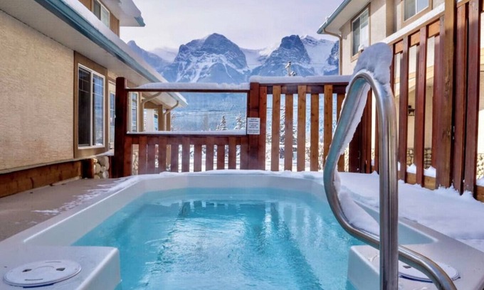 Harvie Heights Condo | Spa Serenity, BBQ Fun, Scenic Mountain Views