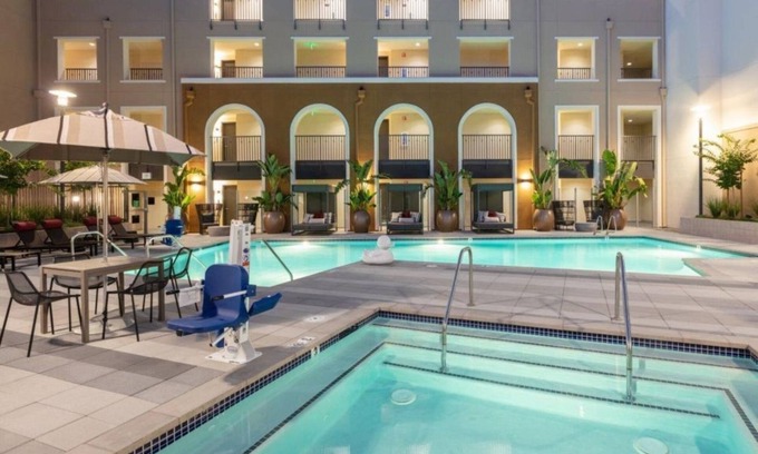 Whisman Station Condo | Spacious 1BR Condo with Serene Pool and Lush Gardens