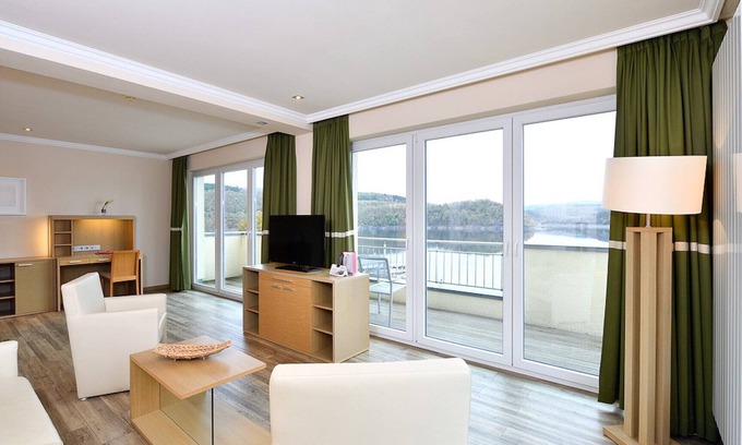 Heimbach Apartment | Spacious double suite with balcony and lake view