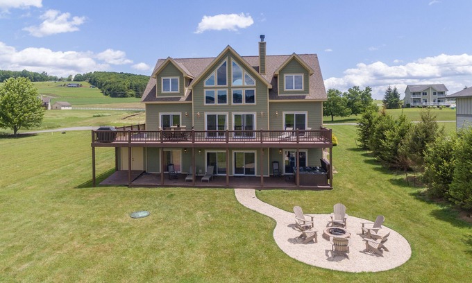 Waterfront Greens House | Spacious Lake Retreat w/Hot Tub & Fireplace