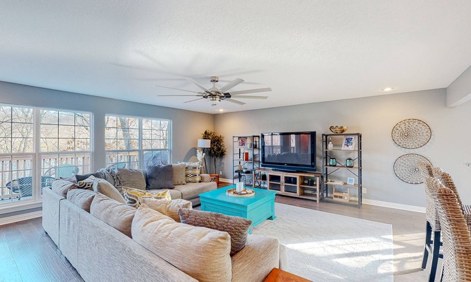 Garfield House | Spacious waterfront home with a washer/dryer, central AC & deck