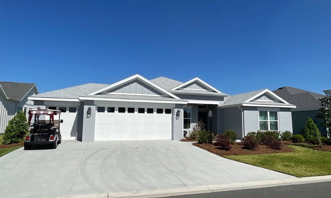 Sumter County House | Stunning new home with water view, screened lanai & golf cart!