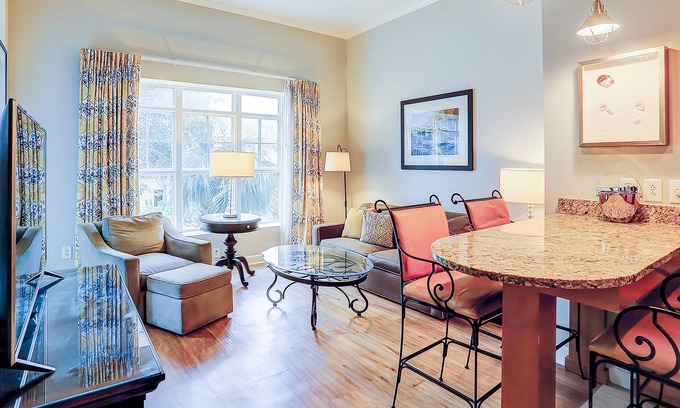 Isle of Palms Condo | Stylish condo near beach & golf with balcony, W/D, pool, hot tub, & firepit