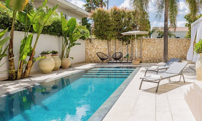 Avola Villa | Stylish holiday home with saltwater pool, a stone's throw from the sandy beach.