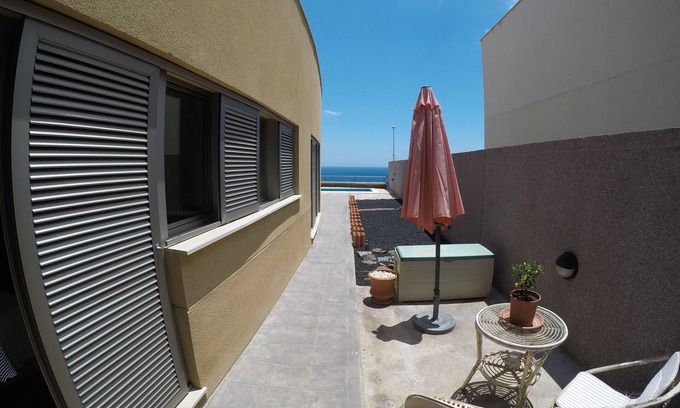 Santa Cruz de Tenerife Apartment | Suite with terrace overlooking the sea and pool for a fee.
