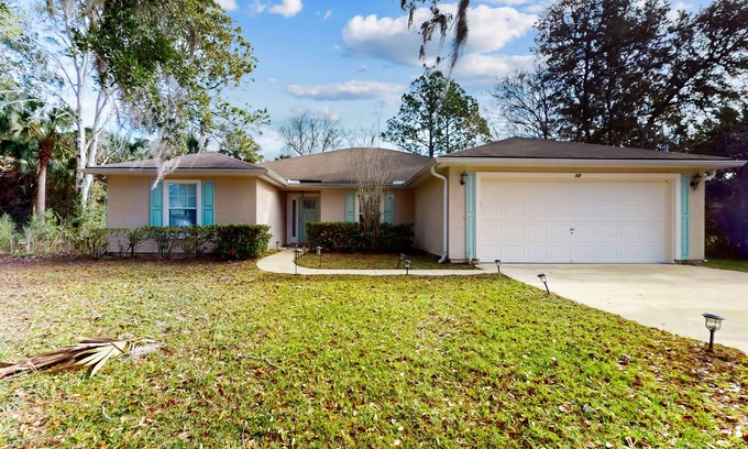 Palm Coast House | Sunny home with private heated pool, pool spa, fireplace, patio, grill, W/D, AC