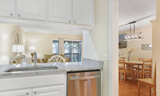 Demere Park Condo | Sunny Pool, 1 mile to the Beach, new TVs, 5 Balconies, and Private Elevator!