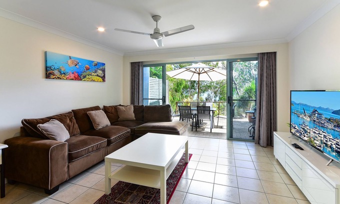 Hamilton Island Apartment | Sunset Waters 01 - Marina Side 2 Bedroom with buggy.