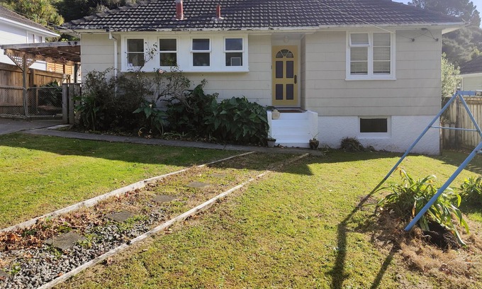Lower Hutt House | The Naes; 1950s Home With Hardwood Floors, Fenced Backyard/ Trampoline