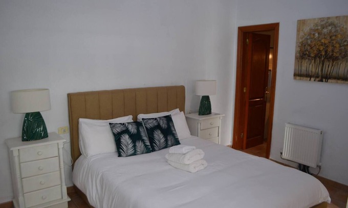 Vilaflor Apartment | This is a double room with a double bed. It has an en-suite bathroom. The window in the room looks out into the hallway.