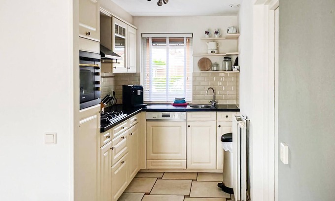 Workum House | This luxury waterfront vacation home is located in a cottage area and close to a boat rental.