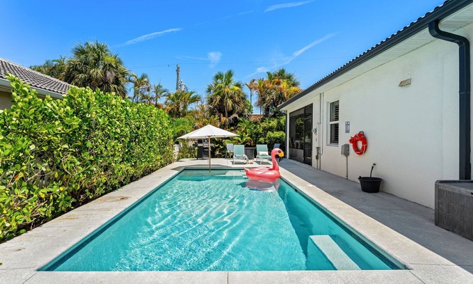 Cocoa Beach House | Tropical Backyard Oasis w/ Screened in Outdoor Patio, Pool, Gas Firepit & BBQ Grill!