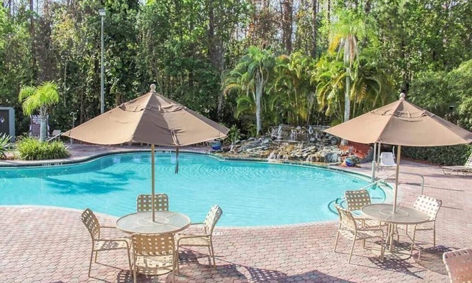 Florida Central Atlantic Coast Resort | Tropical Disney Resort ~ waterfalled pool, tiki bar, jacuzzi ~ mile to Maingate