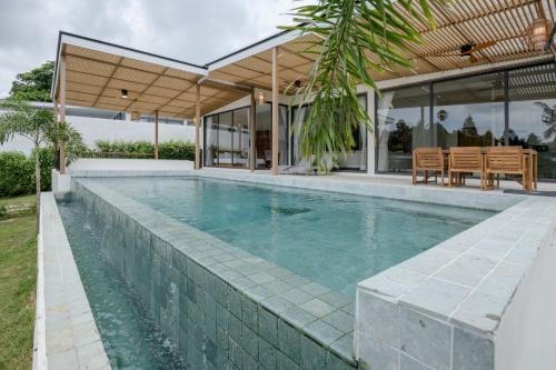 Hin Hong Villa | Tropical Peaceful Poolside Retreat by Sea N' Rent