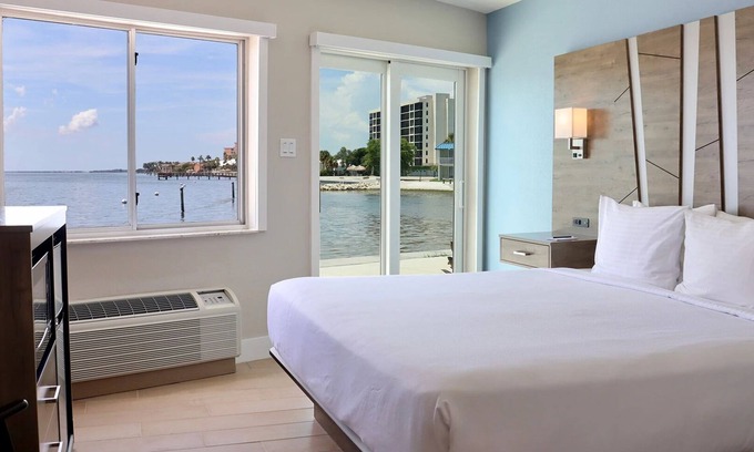 Pinellas Point House | Tropical Retreat: Outdoor Pools, Private Beach, Waterfront Dining