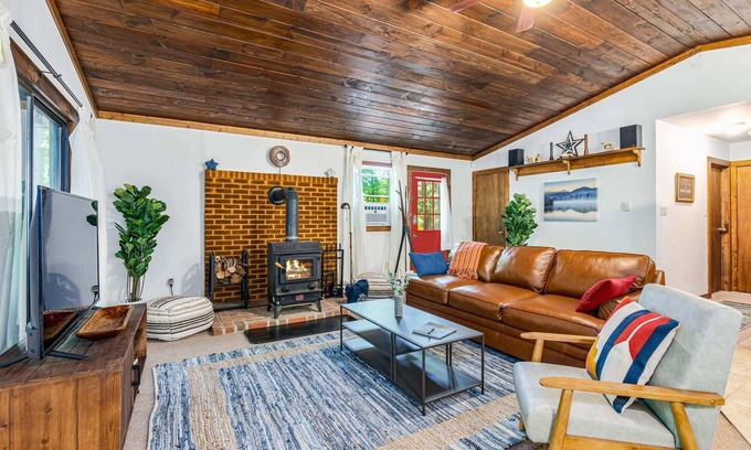 Great Cacapon Cabin | Tucked Away w/Hot Tub, Fire Pit, Deck & WiFi