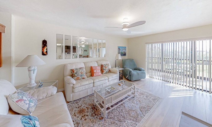 Pine Island Center House | Two-story townhouse with a sunroom, heated pool, hot tub, & tennis courts