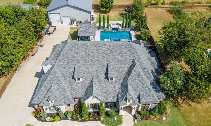 Owasso House | Ultimate Luxury Retreat: House Boasts Hot Tub, Pool, and Easy Airport Access
