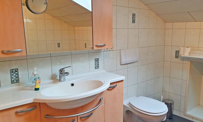 Grassau Apartment | Vacation apartment 95 sqm, for 2-5 pers., 2 bedrooms, kitchen with dishwasher, spacious living room with balcony. Living room, balcony.