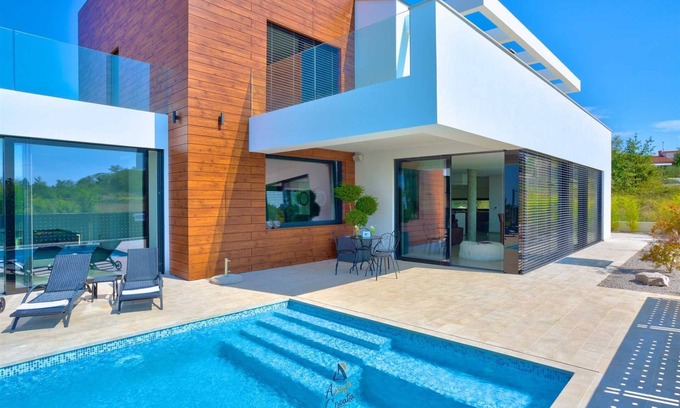Farini Villa | Vibrant modern 5-BR Villa for 10+2, with pool and a sea view