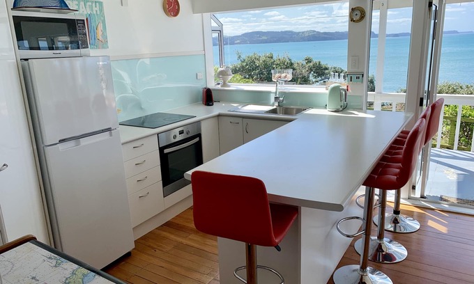 Red Beach House | Vintage Retro style Bach with stunning sea views