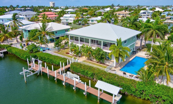 Marathon House | Walk to Beach, 90’ Dock, Huge Pool, Lux Home