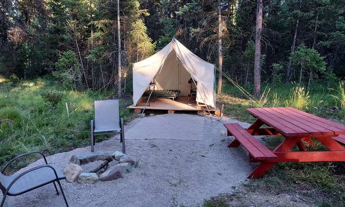 Libby RV Rental | Wall Tent by Happy's Inn with trails to Crystal Lake, bring your own bedding.