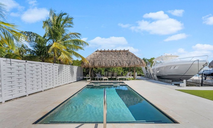 Key Largo House | Waterfront pool home, 2 Tiki's, dock, large covered living/kitchen and game area