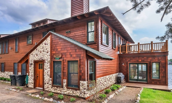Manitowish Waters Condo | Waterfront resort condo with private dock, 4-season porch, & seasonal pool