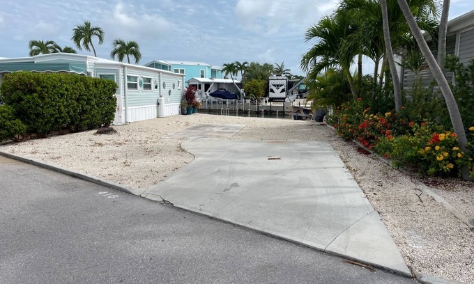 Cudjoe Key RV Rental | Waterfront RV Lot w 35' dock in "Venture Out". Utility hookups & beautiful views