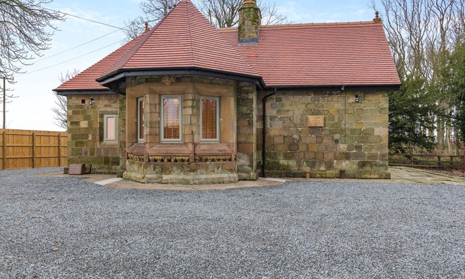 Driffield Cottage | We love this historic lodge with large garden and wood fired hot tub.