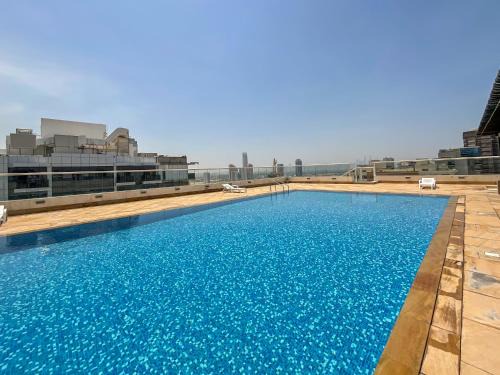 Dubai Sports City Apartment | WelHome - Apt amidst golf courses, perfect for sports lovers