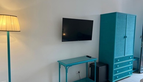 Camera Tripla Elegance vista giardino lato mare