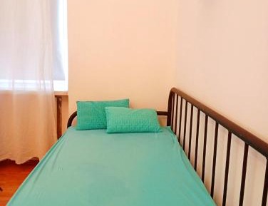 Single Bed in Dormitory Room