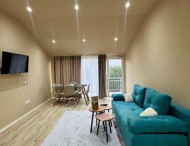 One-Bedroom Apartment with Balcony and City View