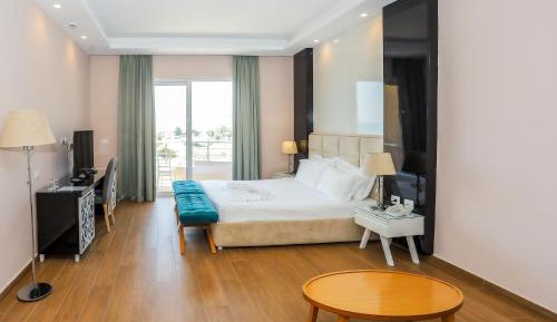 Deluxe Triple Room with Balcony and Side Sea View