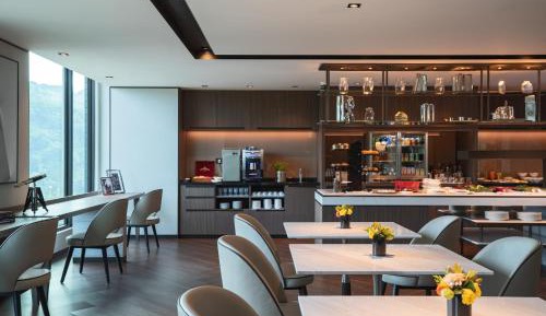 Deluxe Guest Room with King Bed and Sofa - Club Lounge