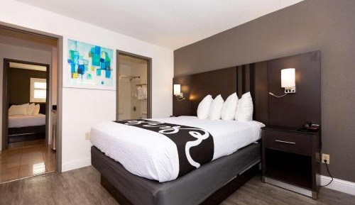 Room with One Queen and Two Double Beds