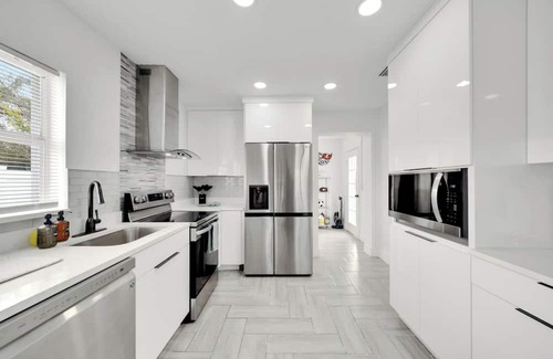 Ybor City House | Relaxing AF Tampa Home with Hot Tub, Outside Fun, and TVs in every room!