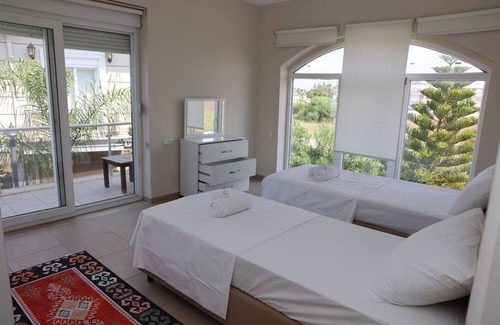 Belek Villa | A large swimming pool in a tranquil environment, offer a blend of comfort.