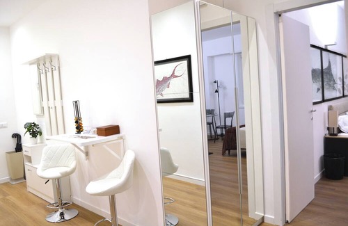Castelletto Apartment | Central penthouse with balcony and city view