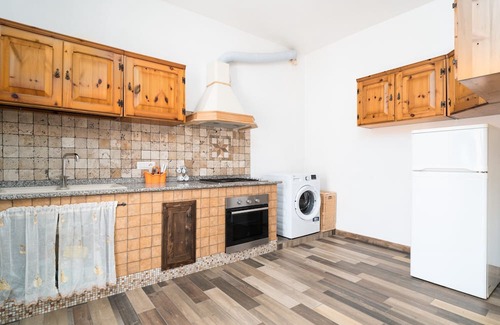 Irgoli Apartment | Apartment 'Casa Vacanza Nel Centro Di Irgoli' with Private Terrace, Wi-Fi and Air Conditioning