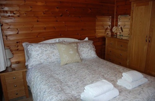 Skelwith Bridge Cabin | Moss Eccles Tarn - Cosy lodge in woodland setting. Pet Friendly.